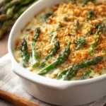 creamy asparagus casserole with golden crispy topping in baking dish