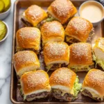 Big Mac-Style Cheeseburger Sliders with sesame buns and melted cheese