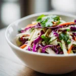 cabbage slaw for tacos with shredded cabbage carrots and lime
