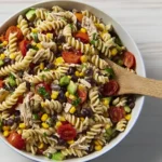 Cowboy Caviar Pasta Salad with rotini pasta, black beans, corn, tomatoes, and chicken