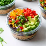 Cowboy Caviar Salad for Meal Prep with avocado, beans, corn, and fresh vegetables