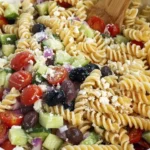 Italian pasta salad with cucumbers, olives, tomatoes, feta cheese, and rotini pasta