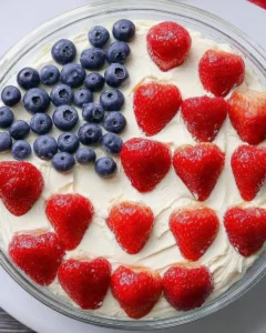 Red White and Blue Desserts topped with strawberries and blueberries in flag design